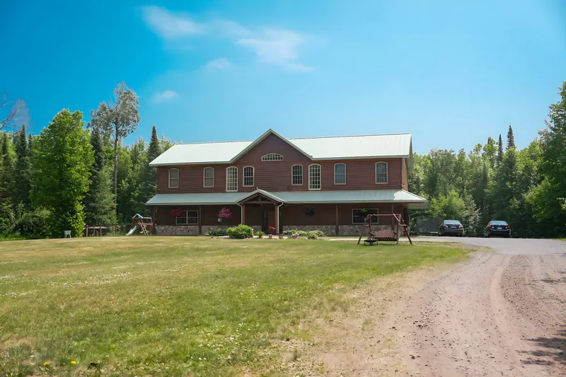 Timber home on a wooded lot near Two Harbors, bought as it stood